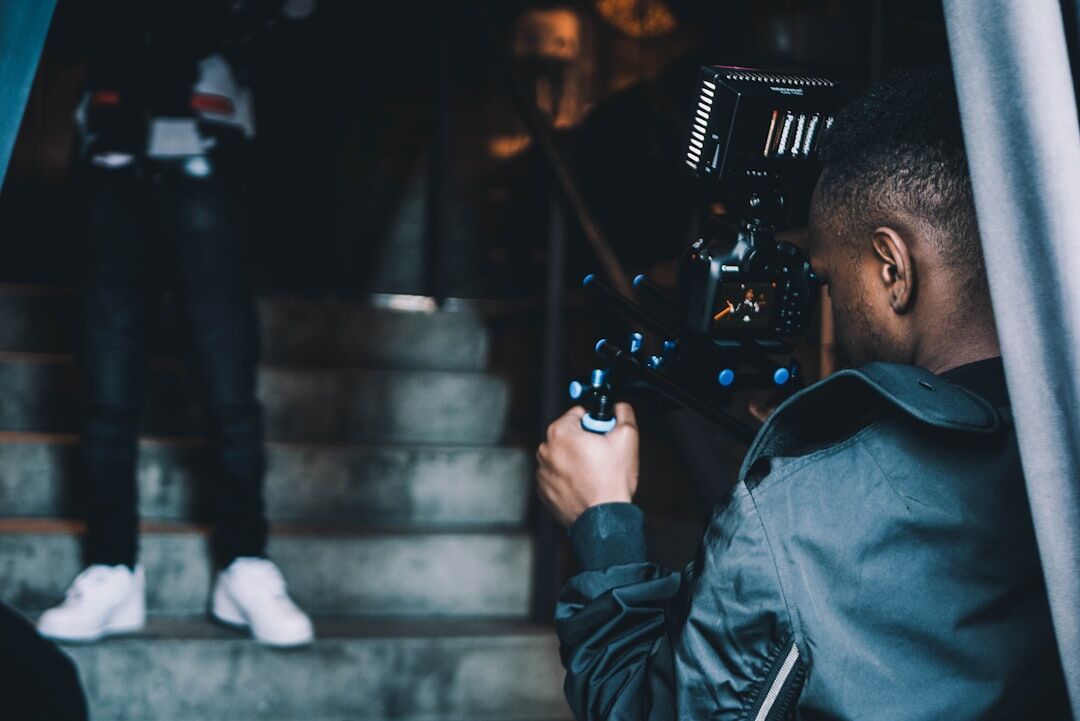 director viewing through camera